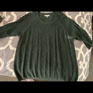 Soft green sweater with cross sleeve detail